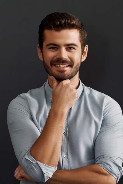 happy-to-work-here-cheerful-young-bearded-man-loo-CT2WE4F.jpg