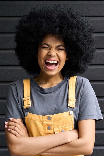 portrait-of-young-laughing-black-woman-isolated-on-XGATQ8D.jpg
